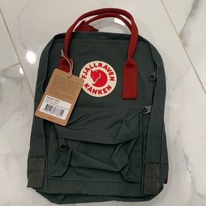 Brand new with tag Fjallraven kanken Mini in forest green and ox red